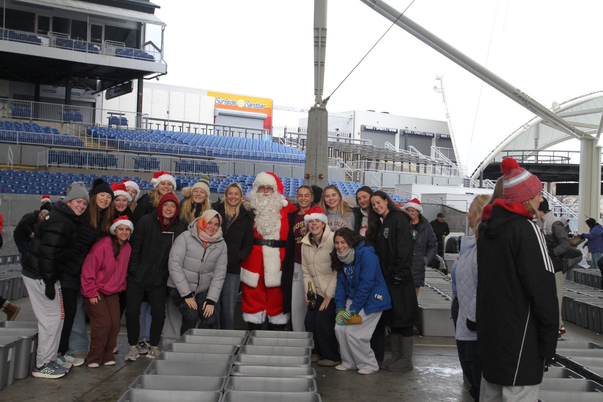 College volunteers with Santa on event day